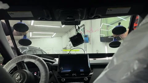 Car Windshield Replacement Process. Workers are replacing a windshield. Stock Footage 340920142