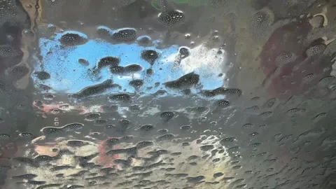 Car Windshield Rinsed from Foam in Automatic Car Wash Stock Footage 333050977