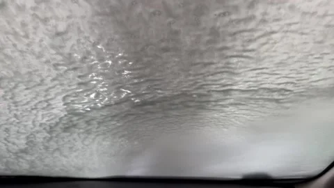 Car windshield rinsing off during automatic car wash Stock Footage 340527315