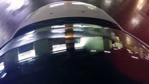 Car windshield. Underground Parking lights reflected in windshield. Camera on Stock Footage 73179955