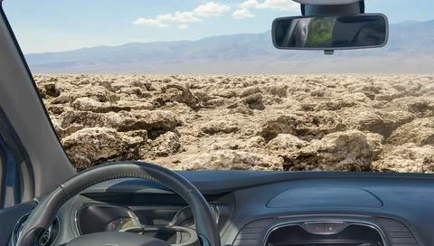 Car windshield view of Devil's Golf Course, Death Valley, USA Stock Photos