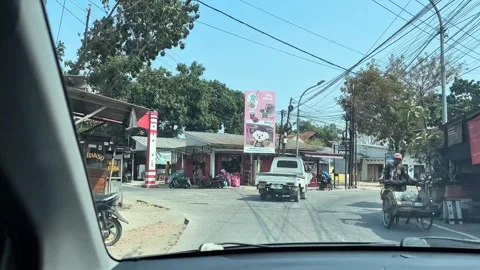 Car Windshield View Driving Past Street Stalls in Cirebon Stock Footage 346438858