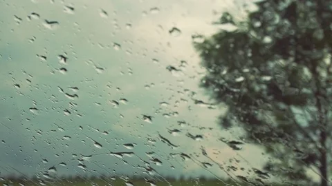 Car windshield wiper are removing rain while driving on the road Stock-Footage 81543330