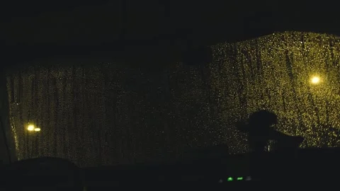 Car windshield wipers cleaning rain at night 스톡 동영상 346004708