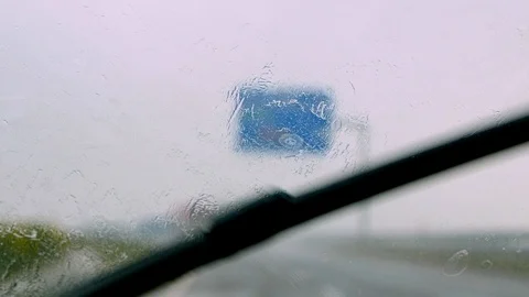 Car Windshield Wipers working during a Deluge Stock Footage 91293258