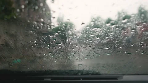 Car windshield wiping rain drops Stock Footage 138734837