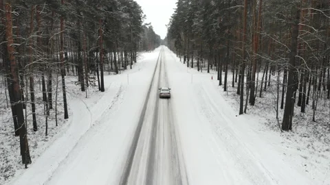 Car on a winter road in the forest, top view Stock Footage 147224460