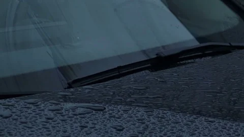 Car Wipers are Removing Rain from the Windshield. Slow Motion Footage Stock Footage 81600418
