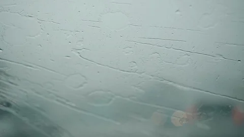 Car wipers cannot remove heavy rain from a car windshield during storm 動画素材 115067639