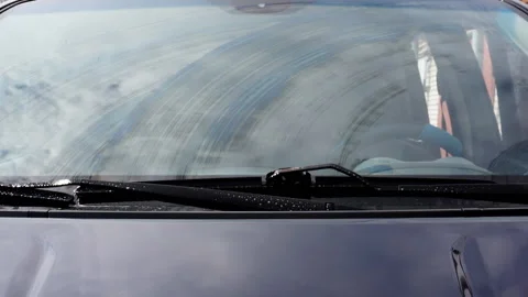 Car wipers remove dirt from the windshield. Stock Footage 129844471