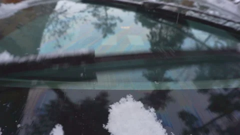 Car wipers sweep snow from the windshield. Stock Footage 100151883