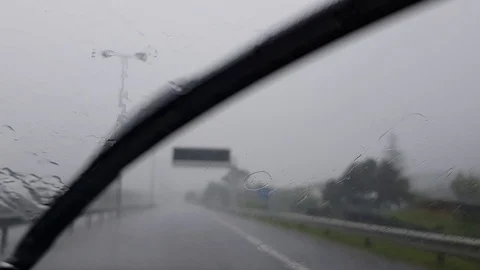 Car wipers work fast during a big rain storm Stock Footage 96577533