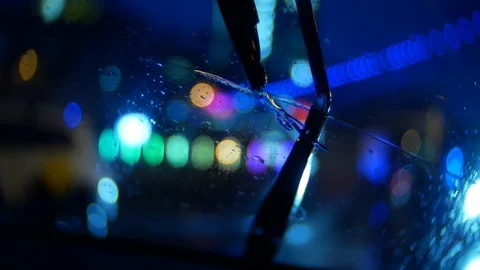 Car wipes remove rain at night in the city Vídeo Stock 87263379
