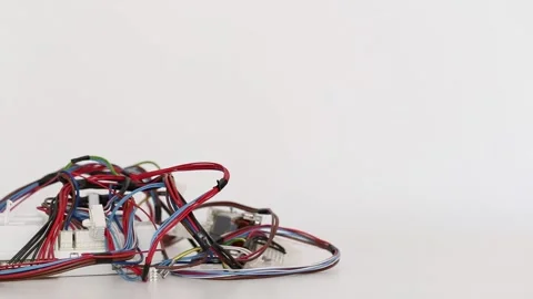 Car wiring kit with electronic engine control unit on a white background Stock Footage 291682524