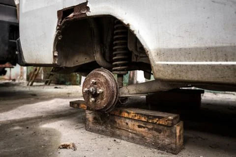 Car without tire Stock Photos
