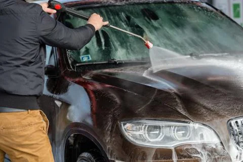 Car without touch washing self-service. Wash with water and foam. Stock Photos