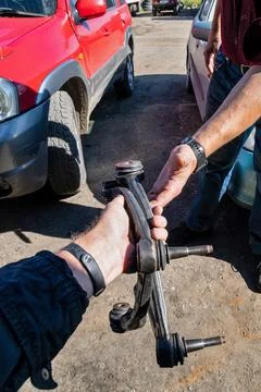 Car workshop - client gives the car parts of automobile from mechanic Stock Photos