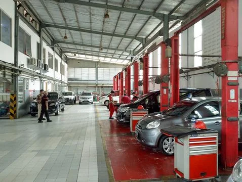 Car Workshop Hustle: Behind the Scenes of Vehicle Maintenance Stock Photos