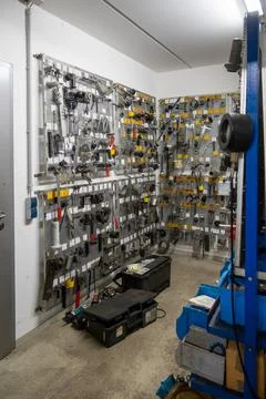 In the car workshop a room with many tools and spare parts on the wall Stock Photos