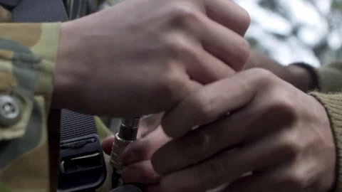 Carabiner being attached to harness Stock Footage 77012489