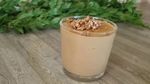 Carame ,coffee l Pudding Dessert in Glass with Crushed Topping | Spoon Scoop Stock Footage 345314992