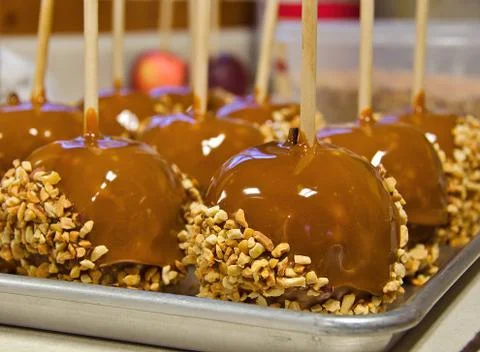 Caramel apples with nuts Stock Photos