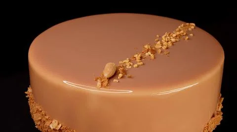 Caramel cake with nuts close-up Stock Photos