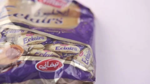 Caramel candy and packet on table Stock Footage 187707707