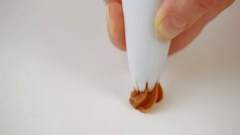Caramel cream on white background Stock Footage 101310154