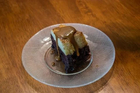 Caramel de leche dripping down the edges of a cake slice Stock Photos
