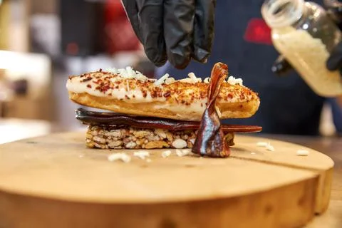 Caramel eclair with cane sugar candy Stock Photos