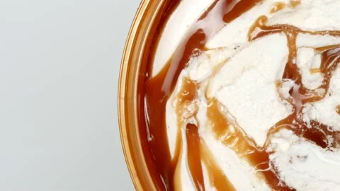 Caramel Ice Cream Rotates On The Table On Right Side. Top View. Close Up. Top Vi Vídeos de archivo 163465229