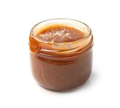 Caramel paste in jar Stock Photos