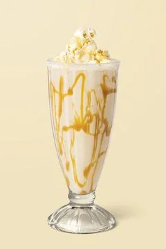 Caramel popcorn vanilla milkshake on background Stock Photos