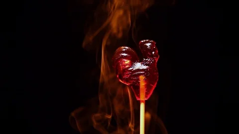 Caramel rooster candy smoke dark background nobody hd footage Stock Footage 100641158