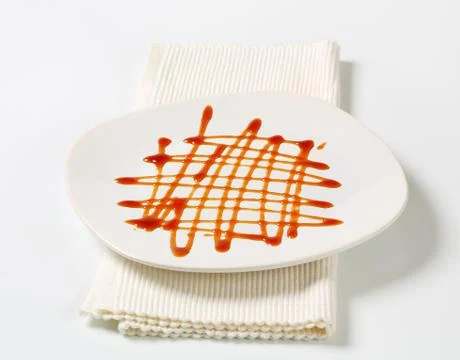 Caramel sauce on a plate Stock Photos
