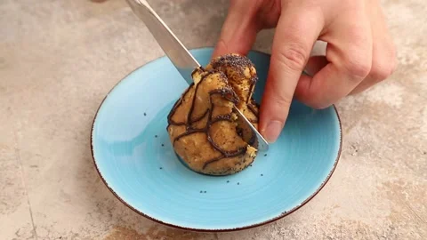 Caramel soft cake cut with a knife on a brown concrete Stock Footage 221550366