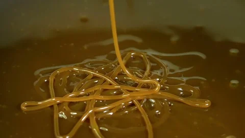 Caramel Swirls String Drip Super Slow Motion 2000fps Stock Footage 82552358