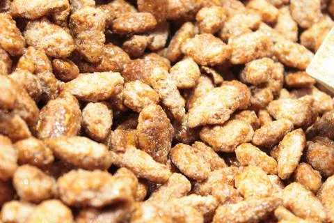 Caramelized almonds in the foreground Stock Photos