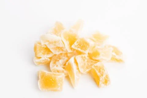 Caramelized ginger candy pieces isolated on white background Stock Photos