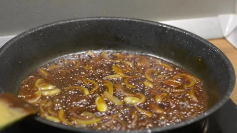 Caramelizing onions Video stock 144979298