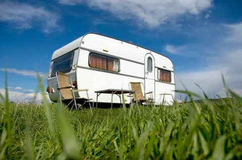 Caravan camping with table and two chars Stock Photos