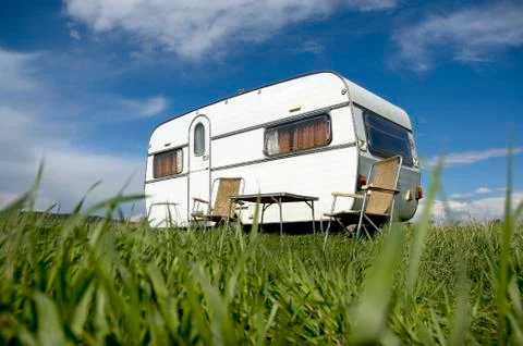 Caravan camping with table and two chars Stock Photos