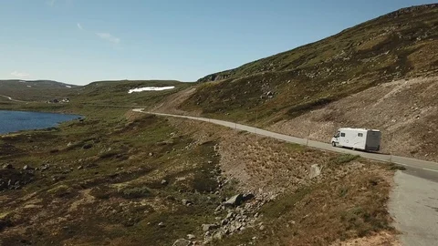 Caravan driving on a mountain Stock Footage 124282680