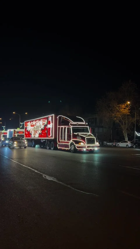Caravan of red trucks with Coca-Cola logo, dancing polar bear, Santa Claus Video stock 324654578