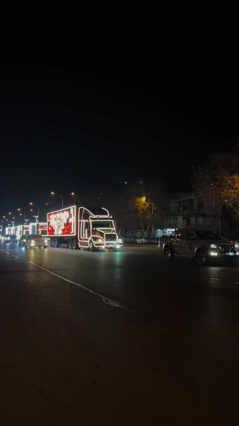 Caravan of red trucks with Coca-Cola logo, Santa Claus, lantern Stock Footage 343683678