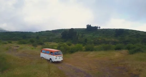 Caravan riding through the rustic country road on a cloudy day Stock Footage 81534961