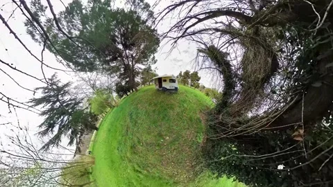 A caravan shot outdoors with a tiny planet effect. Video stock 242455291
