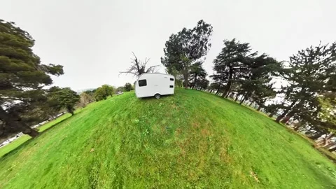 A caravan shot outdoors with a tiny planet effect. Video stock 242455301