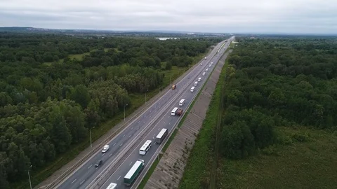 A caravan of white buses with a red cross evacuate people from the affected area Stock Footage 126621974